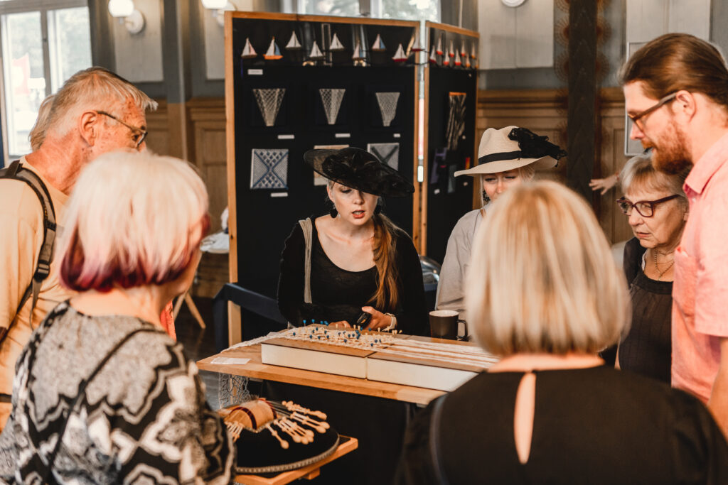 People are getting acquainted with lace-making at the Poselli Cultural Center.