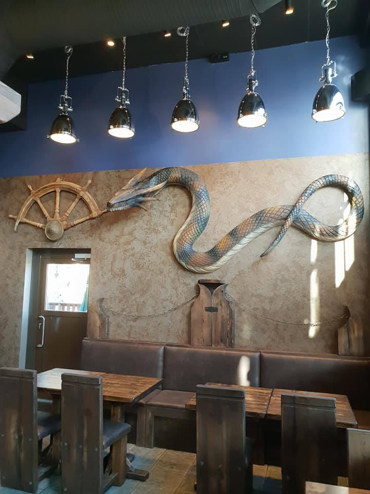 Gastrobar Wanha Krouvi's snake decoration on the wall.
