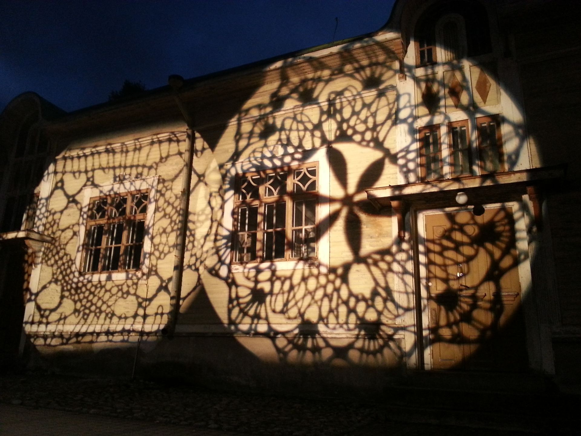 Light lace work on the wall of Seppä House.