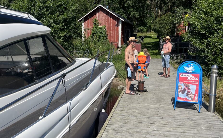 People on a dock and a boat.