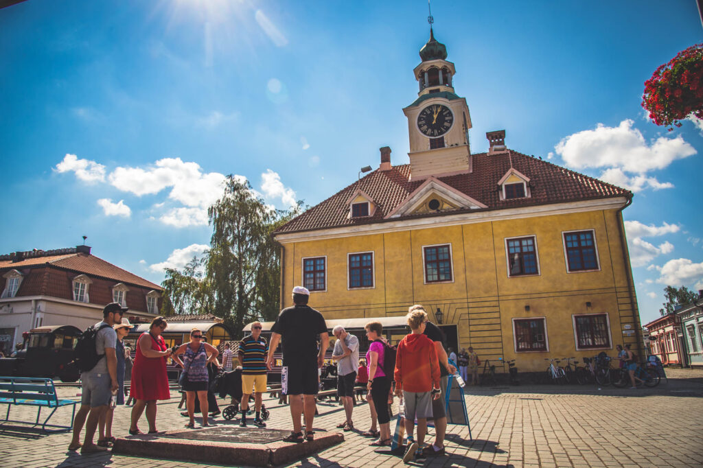 People standing in front of the Old Town hall.