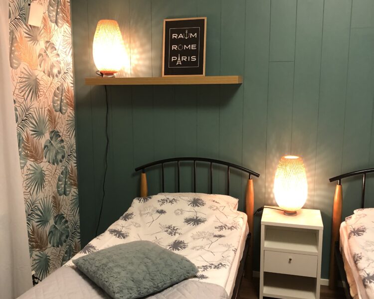 A bed in a room in Haus Anna hotel.