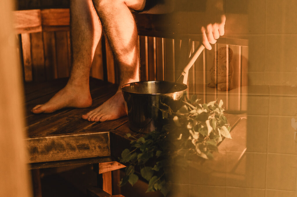 A persons feet in sauna.