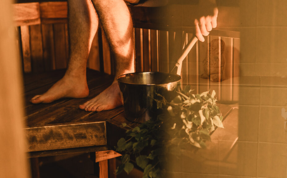A persons feet in sauna.