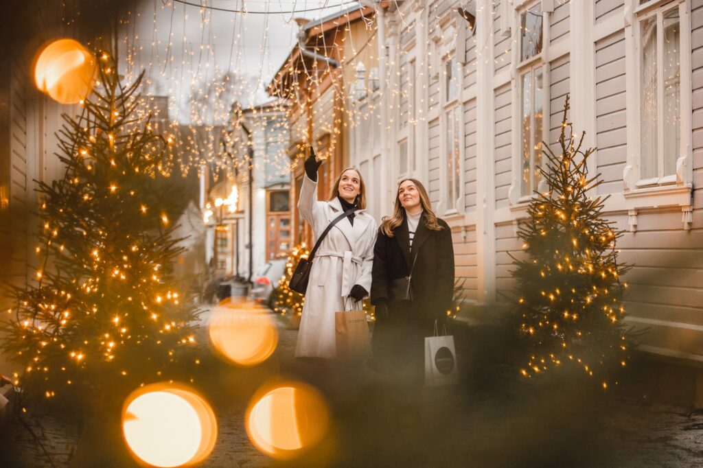Two people in the Christmas tree alley.